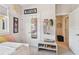 Comfortable bedroom with closet, decorative shelving, and adjacent room access at 925 Monticello N Blvd, St Petersburg, FL 33703