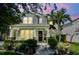 Charming two-story home featuring a welcoming front porch and beautifully landscaped yard at 925 Monticello N Blvd, St Petersburg, FL 33703