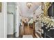 Bright foyer with hardwood floors, staircase, and stylish decor, leading into the home at 925 Monticello N Blvd, St Petersburg, FL 33703