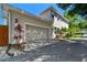 Exterior view of a two-story home showcasing a large garage and driveway at 925 Monticello N Blvd, St Petersburg, FL 33703
