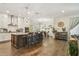 Spacious open kitchen with a large island, seating, white cabinetry, and stainless steel appliances at 925 Monticello N Blvd, St Petersburg, FL 33703