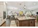 Well-lit kitchen showcasing a large island with granite countertops and stainless steel appliances at 925 Monticello N Blvd, St Petersburg, FL 33703