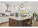 Island kitchen with granite countertops, stainless steel appliances, and seating for four at 925 Monticello N Blvd, St Petersburg, FL 33703