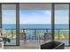 Enjoy breathtaking ocean views from this serene balcony with comfortable seating, perfect for relaxation and entertainment at 100 1St N Ave # 2703, St Petersburg, FL 33701