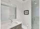 Contemporary bathroom featuring sleek vanity with large mirror, modern fixtures, and glass-enclosed walk-in shower at 100 1St N Ave # 2703, St Petersburg, FL 33701