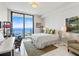 Bright bedroom with floor-to-ceiling windows boasting beautiful water views, stylish furniture, and an area rug at 100 1St N Ave # 2703, St Petersburg, FL 33701