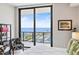 Bright bedroom with floor-to-ceiling windows boasting beautiful water views, stylish furniture, and an area rug at 100 1St N Ave # 2703, St Petersburg, FL 33701