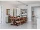 Bright dining room features a large wooden table with seating for eight and a decorative chandelier above the table at 100 1St N Ave # 2703, St Petersburg, FL 33701
