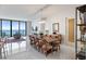 Spacious dining area with water views, chandelier, and modern design at 100 1St N Ave # 2703, St Petersburg, FL 33701