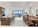 Bright open-concept kitchen and dining area with modern appliances and stunning ocean views at 100 1St N Ave # 2703, St Petersburg, FL 33701