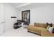 Relaxing living room with cozy sofa, modern artwork, TV, and ample storage, with elegant marble tile flooring at 100 1St N Ave # 2703, St Petersburg, FL 33701