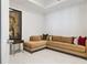 Cozy living room features a comfortable, large sofa, modern art, and marble tile flooring providing a sophisticated feel at 100 1St N Ave # 2703, St Petersburg, FL 33701