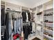 Spacious walk-in closet with custom shelving and ample storage for clothes, shoes, and accessories at 100 1St N Ave # 2703, St Petersburg, FL 33701