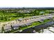 Aerial photograph showcases a home with a screened-in pool and canal frontage, complete with a boat lift at 1028 Signet Dr, Apollo Beach, FL 33572