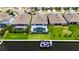 Aerial view of homes on a waterfront featuring private docks and screened pools, enhancing outdoor living at 1028 Signet Dr, Apollo Beach, FL 33572