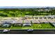 Aerial photograph featuring a home with a screened-in pool, boat lift, and meticulously maintained backyard at 1028 Signet Dr, Apollo Beach, FL 33572