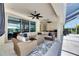 The covered patio with ample seating space for relaxing and entertaining guests at 1028 Signet Dr, Apollo Beach, FL 33572