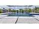 The gorgeous backyard pool features a screened enclosure, fountains, and a blue tiled spa at 1028 Signet Dr, Apollo Beach, FL 33572