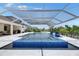 A screened-in lanai features a spa and swimming pool, perfect for relaxing and entertaining at 1028 Signet Dr, Apollo Beach, FL 33572