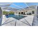 Relax in this private screened-in pool oasis and lounge on the patio at 1028 Signet Dr, Apollo Beach, FL 33572