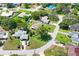 Aerial view of a property with mature trees near other homes in a neighborhood at 1038 Shenandoah Ln, Spring Hill, FL 34606