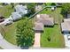 Aerial view of a home featuring a well manicured lawn and a fenced yard at 1038 Shenandoah Ln, Spring Hill, FL 34606