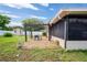 Outdoor patio with a pergola, furniture, and lush green lawn, perfect for outdoor entertaining and relaxing at 1038 Shenandoah Ln, Spring Hill, FL 34606
