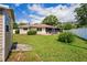 Backyard view with the exterior of the home and an outdoor patio at 1038 Shenandoah Ln, Spring Hill, FL 34606