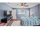 Comfortable bedroom showcasing a window, a dresser with television, and calming wall color at 1038 Shenandoah Ln, Spring Hill, FL 34606