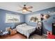 Comfortable bedroom featuring natural light, neutral walls, and ceiling fan at 1038 Shenandoah Ln, Spring Hill, FL 34606