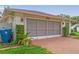 Street view of the screened garage and driveway of a home at 1038 Shenandoah Ln, Spring Hill, FL 34606