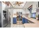 Bright kitchen with stainless steel appliances, two-tone cabinets, and plenty of natural light at 1038 Shenandoah Ln, Spring Hill, FL 34606