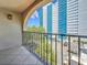 Balcony with wrought iron railing offering city views, and building with parking area at 105 4Th Ne Ave # 426, St Petersburg, FL 33701
