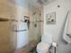 Modern bathroom featuring glass enclosed shower with tiled floors, stone walls and updated fixtures at 105 4Th Ne Ave # 426, St Petersburg, FL 33701