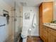 Well maintained bathroom with glass enclosed shower, stylish tiling, granite countertop, and wood cabinet at 105 4Th Ne Ave # 426, St Petersburg, FL 33701