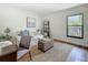 Bedroom featuring neutral tones, a comfortable sofa, and a view of the outdoors at 105 4Th Ne Ave # 426, St Petersburg, FL 33701