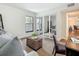 Bedroom featuring a comfortable sofa, natural light, and a mirrored closet at 105 4Th Ne Ave # 426, St Petersburg, FL 33701