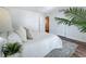 Stylishly staged bedroom featuring a bright interior, neutral decor, rug, and wood look floors at 105 4Th Ne Ave # 426, St Petersburg, FL 33701