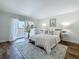 Well decorated bedroom with balcony, light interior, modern decor, rug and wood look floors at 105 4Th Ne Ave # 426, St Petersburg, FL 33701