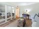 Comfortable bedroom featuring mirrored closet doors, natural light, and a cozy sitting area at 105 4Th Ne Ave # 426, St Petersburg, FL 33701