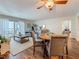 Cozy living area featuring a dining table, balcony access, and stylish furnishings at 105 4Th Ne Ave # 426, St Petersburg, FL 33701