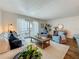 Spacious living room featuring modern decor, lots of natural light, and a private balcony at 105 4Th Ne Ave # 426, St Petersburg, FL 33701