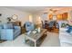 Comfortable living room featuring an open floor plan, dining area, and wood floors at 105 4Th Ne Ave # 426, St Petersburg, FL 33701