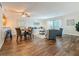 Open-concept living room boasts wood flooring, a dining area, and access to the balcony at 105 4Th Ne Ave # 426, St Petersburg, FL 33701