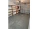 Spacious garage with shelving units, ready for storage or workshop space at 1107 Queen Anne Dr # C, Palm Harbor, FL 34684