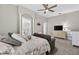 Large bedroom with a seating area and a view of the bathroom and walk-in closet at 111 Falling Water Dr, Brandon, FL 33511