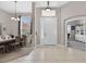 Spacious front foyer with tile floors, adjacent dining room, and direct access to a home office at 111 Falling Water Dr, Brandon, FL 33511