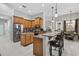 Spacious kitchen featuring granite countertops, stainless steel appliances, and custom-built wooden cabinets at 111 Falling Water Dr, Brandon, FL 33511