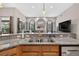 Open-concept kitchen with breakfast bar overlooking the living room creating a cohesive living space at 111 Falling Water Dr, Brandon, FL 33511