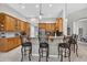 Kitchen bar with granite countertop and seating for four, providing a perfect gathering spot at 111 Falling Water Dr, Brandon, FL 33511
